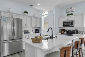 Fridge, microwave, oven, stovetop - Spacious 6-bedroom house with Private Pool/Spa, Game Room, & Resort Perks (Clermont)