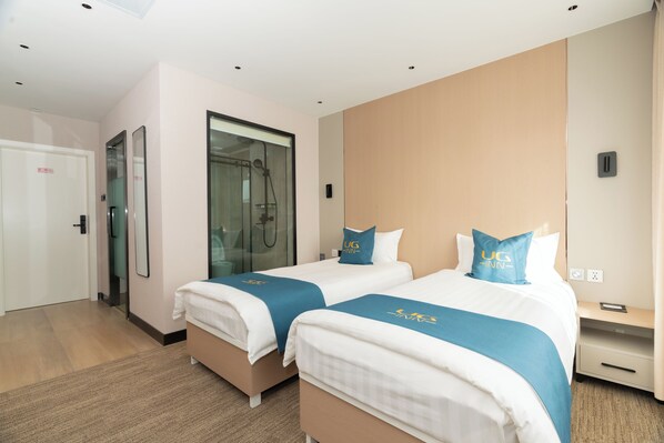 Standard Twin Room, City View | Bathroom | Shower, hair dryer, slippers, towels - UG Inn Hotel (Ulaanbaatar)