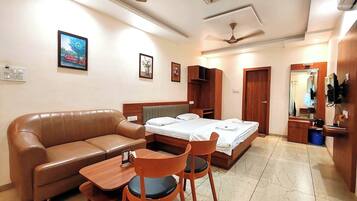 Deluxe Suite, Balcony, City View | Desk, laptop workspace