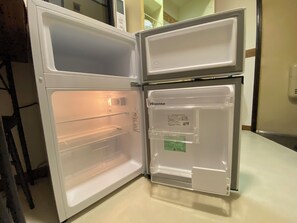 An open refrigerator with a Hisense brand label, a transparent door, and a freezer compartment. - 30sec walk to Tsutenkaku/1 stop to Namba Sta./AH55 (Ebisu Higashi Naniwa-Ward,Osaka City)