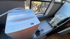 A room with a white portable water heater, a small heater, and a metal railing. - 30sec walk to Tsutenkaku/1 stop to Namba Sta./AH56 (Ebisu Higashi Naniwa-Ward,Osaka City)