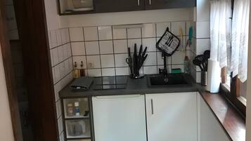 Fridge, microwave, stovetop, coffee/tea maker