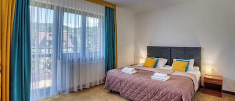 Apartment, Balcony, Garden View | In-room safe, soundproofing, iron/ironing board, free WiFi