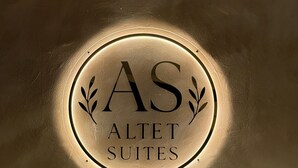 A circular sign with the text "AS ALLET SUITES" indicating the name of a hotel or property. - HS Altet Suites - Alicante Airport (Elche)