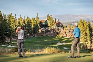 A golf course with a clubhouse and a mountainous backdrop. - Hot tub, Game Room, Sleeps 16, No neighbors, Near Palisades, Woods (Truckee)