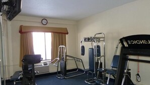 A hotel room with a treadmill, exercise bike, and a massage chair. - Hotel in Millinocket Maine with pool, lounge, food & Snowmobile/ATV trail access (Millinocket)