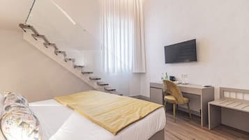 Deluxe Room, City View | In-room safe, desk, laptop workspace, blackout drapes