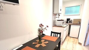 A compact kitchen with a microwave, toaster, and coffee maker. - Ancrage New Studio Garden Floor (Plouedern)
