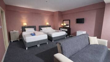 Premium bedding, memory-foam beds, desk, laptop workspace