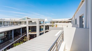 A modern building with multiple balconies and large windows. - Seaside Village J9 by Ctha (Cape Town)