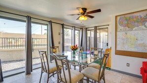 A dining area with a glass table, chairs, and a ceiling fan. - Private Pool & Patio! Home 8 Mi to Dtwn Phoenix (Phoenix)