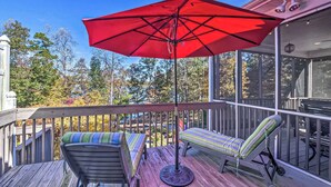 A wooden deck with two lounge chairs and a red umbrella. - Boat Dock: Lake-view Retreat 5 Mi to Dtwn Clemson (Seneca)