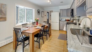 A modern kitchen with wooden cabinetry, a built-in oven, and a large window. - 8 Mi to Dtwn Saratoga Springs: Quiet Family Home (Saratoga Springs)