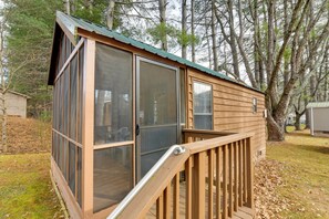 A small wooden cabin with a deck and large windows. - Escape to Blue Ridge Mtns! Studio w/ Resort Perks (Waynesville)