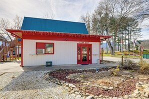 A small building with a red door and a sign that reads "GAME ROOM". - Escape to Blue Ridge Mtns! Studio w/ Resort Perks (Waynesville)