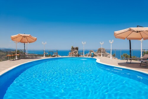 Villa Caterina is situated on a rock and surrounded by extensive countryside. Wooden ceilings, stone walls and antique Sicilian decorations define the character of this impressive villa.The villa consists of a large living room with a fireplace, a spacio