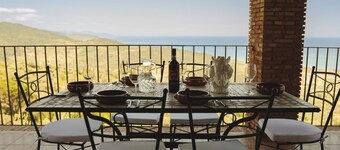 Villa Caterina is situated on a rock and surrounded by extensive countryside. Wooden ceilings, stone walls and antique Sicilian decorations define the character of this impressive villa.The villa consists of a large living room with a fireplace, a spacio