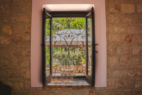 Interior - Villa Caterina is situated on a rock and surrounded by extensive countryside. Wooden ceilings, stone walls and antique Sicilian decorations define the character of this impressive villa.The villa consists of a large living room with a fireplace, a spacio (Acquedolci)