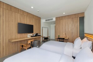 Habitación Deluxe | Ropa de cama de alta calidad y tabla de planchar con plancha