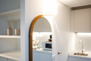 Fridge, microwave, cookware/dishes/utensils, dining tables