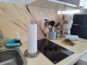 Private kitchen - Beautiful and cozy studio apartment in the heart of Isla Verde. (Carolina)