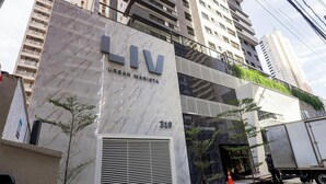 A modern building with the sign 'LIV URBAN MARISTA' and the number '319'. - Studio w/ Self Check-in in Goiania Liu1606 (Goiânia)