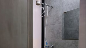 A small, modern bathroom with a shower, a sink, and a window. - Affordable Studio Apartment Near JKIA, Fedha Embakasi. (Nairobi)