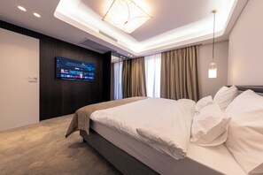 Deluxe Apartment, Balcony, City View | In-room safe, desk, blackout drapes, soundproofing