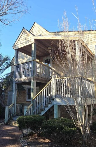 Second-floor two-bedroom villa with screened porch.