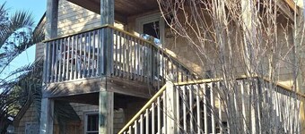 Second-floor two-bedroom villa with screened porch.