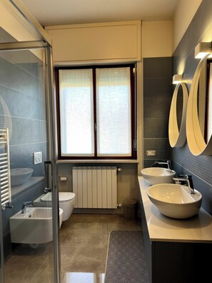 Bidet, towels, toilet paper