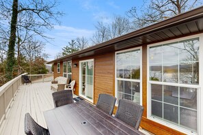 Outdoor dining - Peaceful Top-Floor Retreat with Lake Views, Spacious Deck, AC, and Washer/Dryer (Garfield)