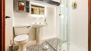 A bathroom with a toilet, sink, and glass shower enclosure. - The George Inn Rooms - Room 2 (Great Missenden)