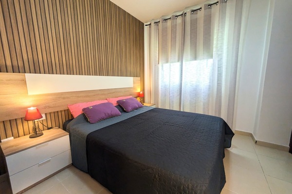 Family Apartment, Balcony, City View | Blackout drapes, iron/ironing board, WiFi (free), bed sheets