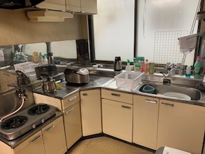 Basic Shared Dormitory, Women only, Non Smoking | Shared kitchen | Full-size fridge, microwave, stovetop, cookware/dishes/utensils - TRAVELRS INN minamioodori (Kushiro)