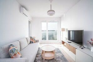 Apartamento Confort | Sala de estar | Una Smart TV