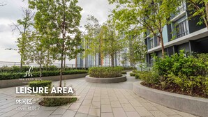 A leisure area with a tiled pathway, trees, and a building in the background. - Core Soho Suites Sepang by The Stay Hub (Sepang)