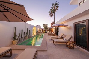 Outdoor pool, open 6:00 AM to 10:00 PM, pool umbrellas, sun loungers