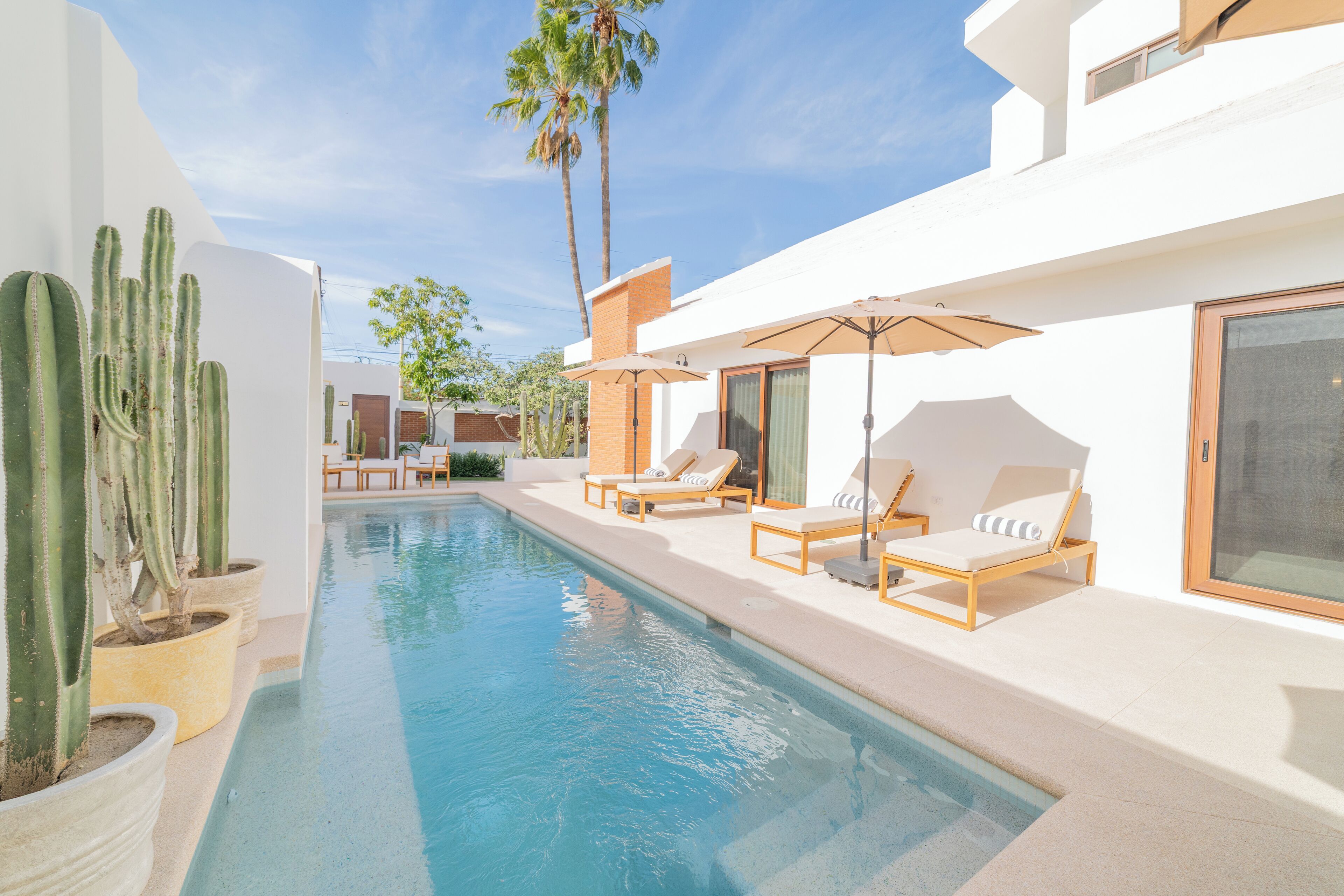 Outdoor pool, open 6:00 AM to 10:00 PM, pool umbrellas, pool loungers