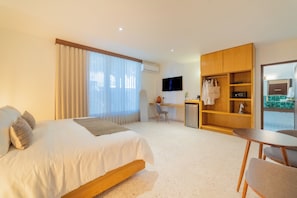 Habitación superior | Ropa de cama de alta calidad y minibar