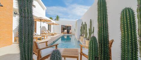 Outdoor pool, open 6:00 AM to 10:00 PM, pool umbrellas, pool loungers