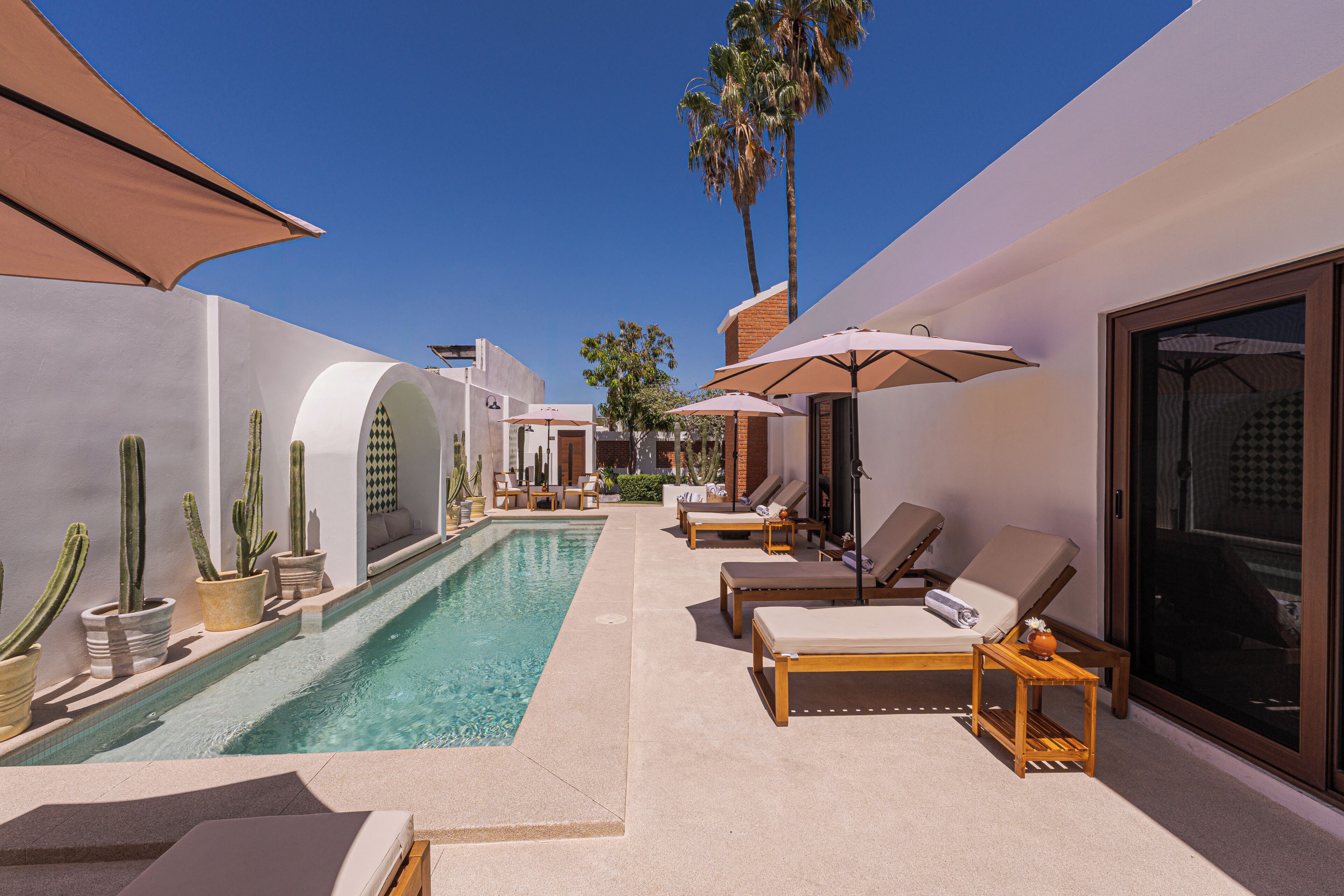 Outdoor pool, open 6:00 AM to 10:00 PM, pool umbrellas, sun loungers
