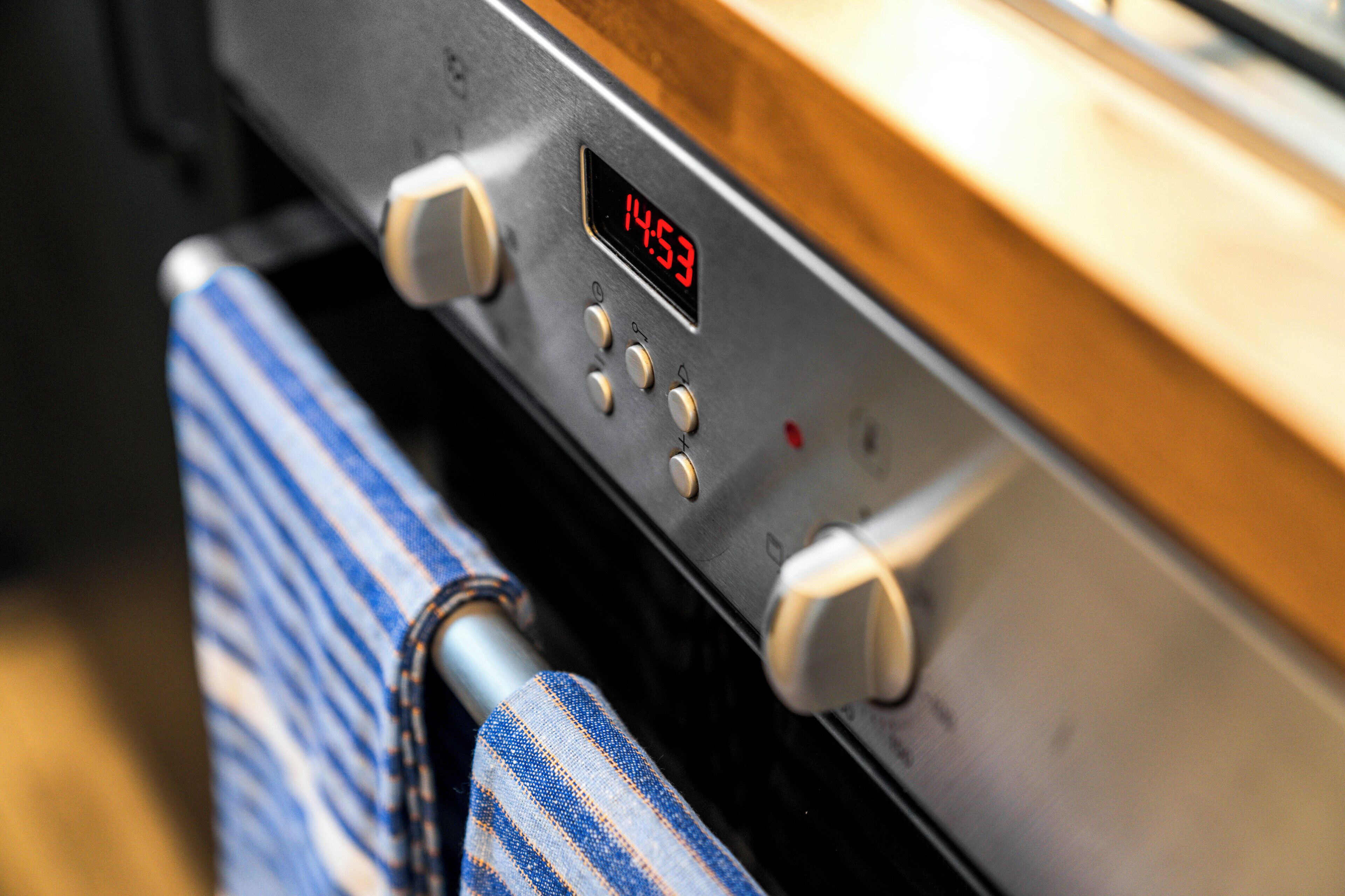 A control panel with a digital clock displaying 14:53.