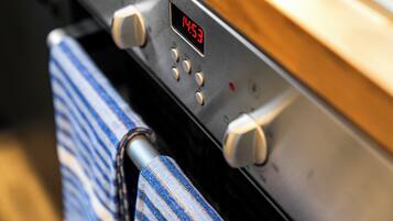 A control panel with a digital clock displaying 14:53.