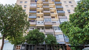 A multi-story residential building with balconies, a ground-level entrance, and surrounding greenery. - Bastia - Skyline 1-BR Apt in Nicosia (Nicosia)