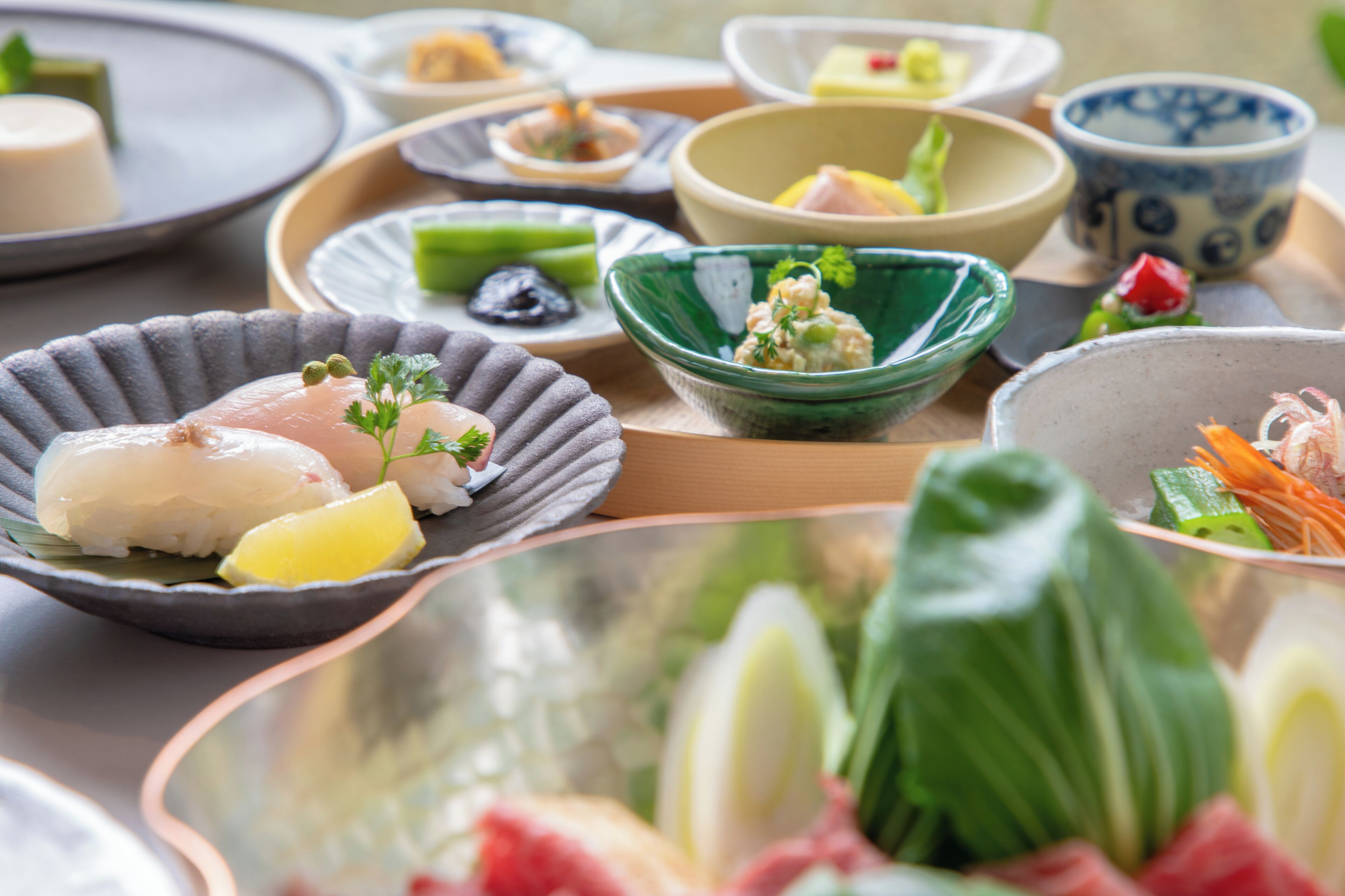 A variety of dishes on a tray with different bowls and plates.