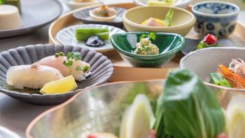 A variety of dishes on a tray with different bowls and plates.