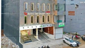 A multi-story building with a sign reading "Hotel The Golden Tree." - Hotel The Golden Tree (Damoh)