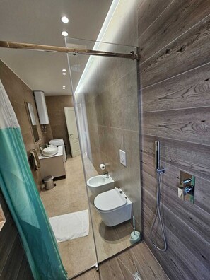 Family Apartment, City View | Bathroom | Shower, towels, soap, shampoo - My Apartments Tirana (Tirana)