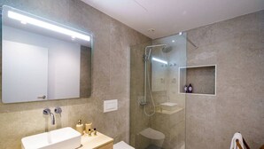 A modern bathroom with a large mirror, a rectangular sink, a toilet, and a glass-enclosed shower area. - Carvoeira Nature & Serenity Escape by Lisbeyond (Barril)